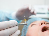 a close-up of a dental implant post before placement