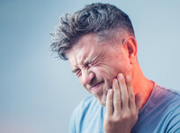 man has oral pain